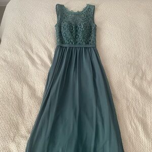 Beautiful turquoise long and elegant dress with back neckline.